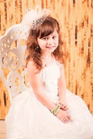 Beautiful girl in a dress posingの写真素材