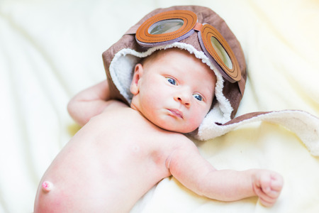 Cute newborn baby in a hat, first daysの写真素材