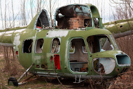 Old destroyed Soviet abandoned military airplanes in the field in Ukraine. Former soviet aviation wreckage after second world warの写真素材
