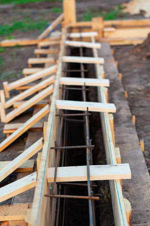 Reinforcement of corners for creating strip foundation for new house basis.の写真素材