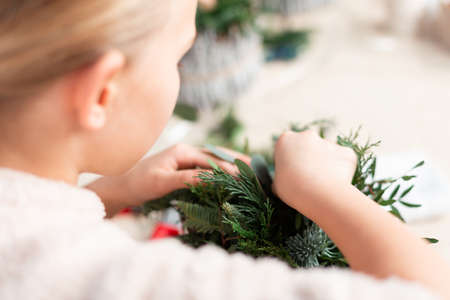 Creating Christmas floral arrangement with carnations, chrysanthemum santini flowers and fir. Floral Design basicsの写真素材