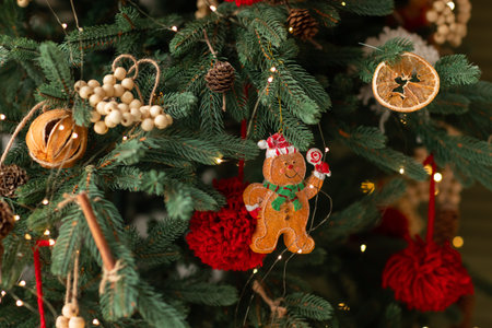 Beautiful Christmas tree decorated with gingerbread, dried oranges and cinnamon. Merry Christmas and...