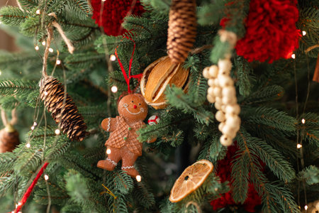 Beautiful Christmas tree decorated with gingerbread, dried oranges and cinnamon. Merry Christmas and...