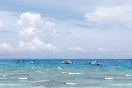 Landscape picture of sea view with small boats and blue skyの写真素材