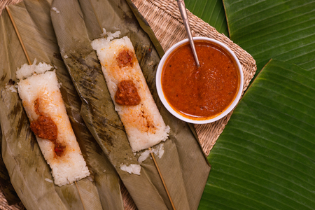 top view of open sticky rice wrapped in leaves and served with peanut sauce. Famous cuisine in Borneo. Brunei, Sarawak and Sabah. Called Kelupis.の写真素材