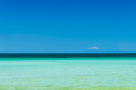 Turquoise sea water and blue sky background. Vacation, holiday, tourism conceptの写真素材