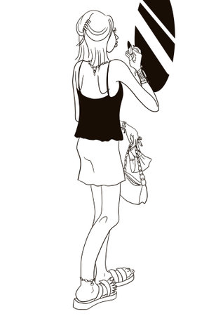 Young fashionable woman paints lips in front of a mirror while removing protective mask in a public place. The desire to be beautiful despite the quarantine restrictionsの写真素材
