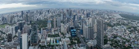 A panoramic view of Bangkok, Thailand, showcases a sprawling urban landscape filled with modern...