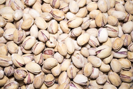 Roasted and salted pistachios in shell. Food background.の写真素材