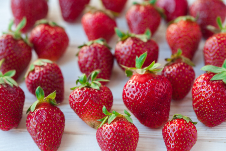 Strawberries ripe on a white wooden background. Copy space. Healthy lifestyle conceptの写真素材