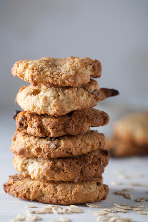 A stack of homemade oatmeal cookies on a grey background.の写真素材