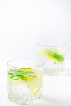 Basil lemon water. Drink infused water cocktail. Healthy lifestyle concept. Copy spaceの写真素材