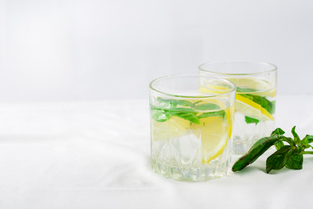 Basil lemon water. Drink infused water cocktail. Healthy lifestyle concept. Copy spaceの写真素材