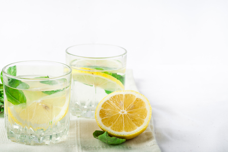 Basil lemon water. Drink infused water cocktail. Healthy lifestyle concept. Copy spaceの写真素材