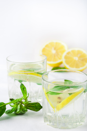Basil lemon water. Drink infused water cocktail. Healthy lifestyle concept. Copy spaceの写真素材