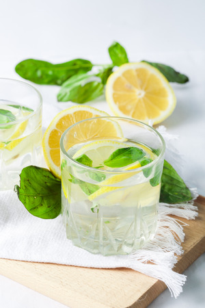 Basil lemon water. Drink infused water cocktail. Healthy lifestyle concept. Copy spaceの写真素材
