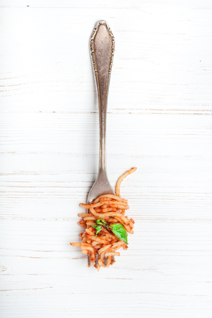 Italian spaghetti with a bolognese tomato meat sauce and basil. Copy space. Italian food concept.の写真素材