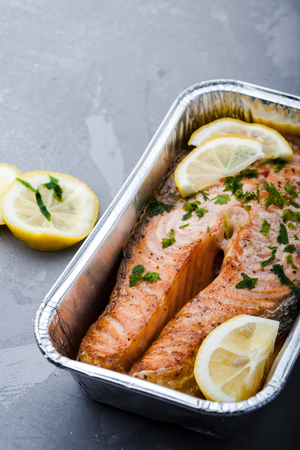 Fish with lemon on a grillの写真素材