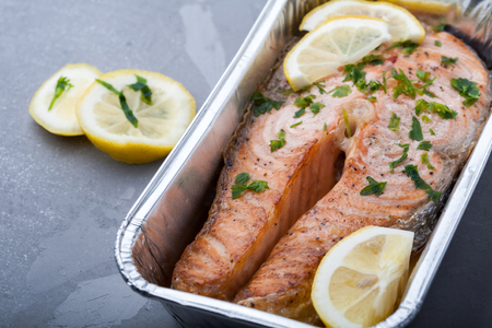 Fish with lemon on a grillの写真素材