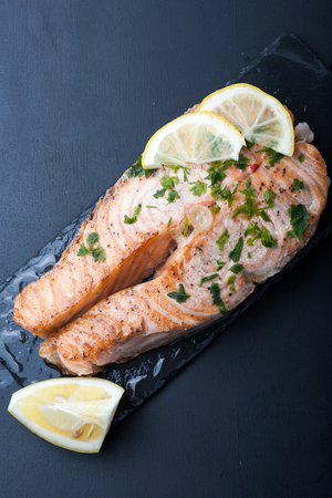 Fish with lemon on a grillの写真素材