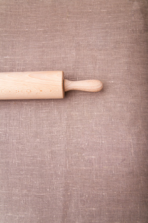 Baking ingredients. Flour, eggs, wheat and rolling pin on  table cloth. Rustic. Copy spaceの写真素材