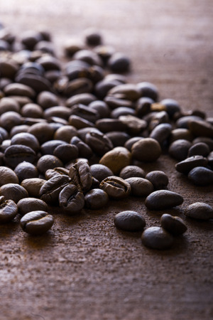 Photo closeup of coffee beans. Rusty background. Copy space.の写真素材
