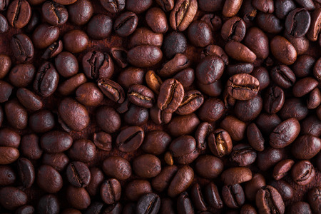 Photo closeup of coffee beans. Rusty background. Copy space.の写真素材