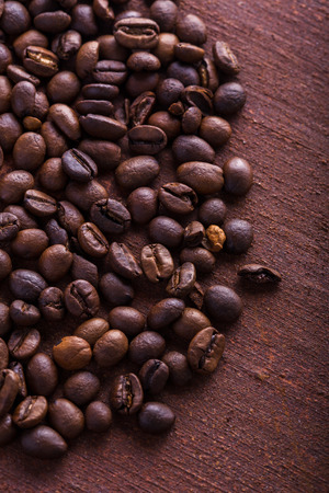 Photo closeup of coffee beans. Rusty background. Copy space.の写真素材