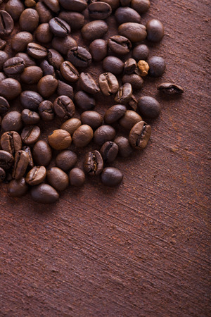 Photo closeup of coffee beans. Rusty background. Copy space.の写真素材