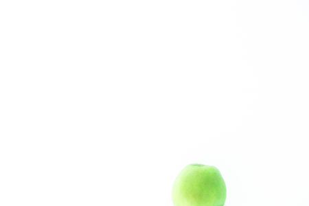 Green apple on white background minimalism. Copy spaceの写真素材