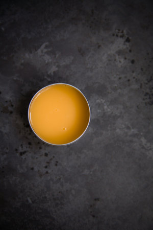 Natural spa cosmetics on a dark blue beton concrete background. Beauty blogger, minimalism concept,...