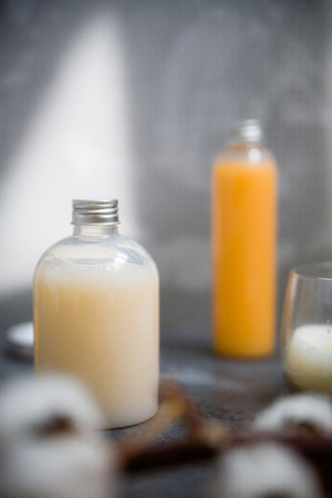 Natural spa cosmetics on a dark blue beton concrete background. Beauty blogger, minimalism concept, copy spaceの写真素材
