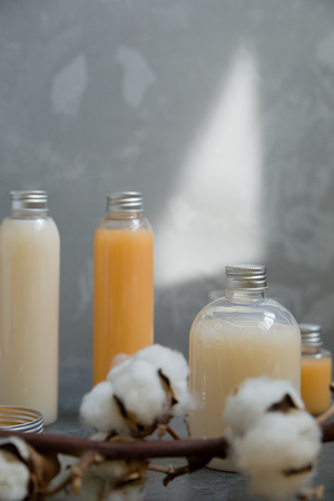 Natural spa cosmetics on a dark blue beton concrete background. Beauty blogger, minimalism concept, copy spaceの写真素材