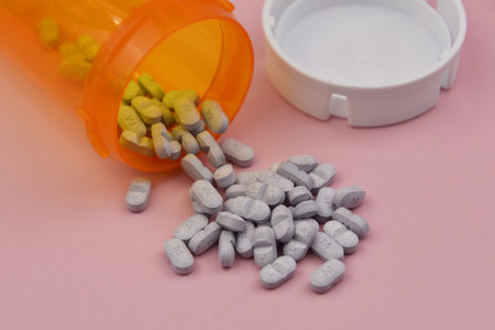 Tablets on pink background, medicines, drugs, health care concept
