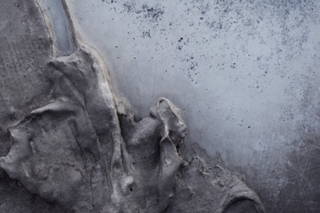 abstract background, black and white texture of a piece of plasterの写真素材