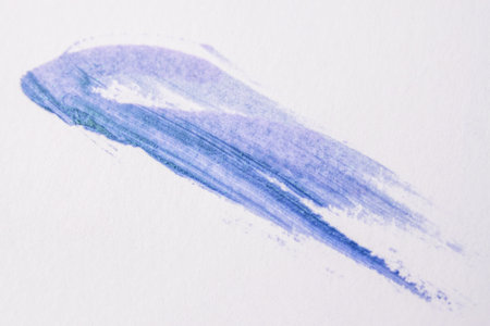 Blue watercolor stroke on white paper. Abstract background with copy spaceの写真素材