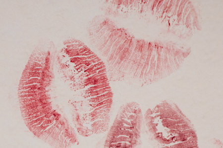 Lipstick imprints on white paper, closeup of photoの写真素材