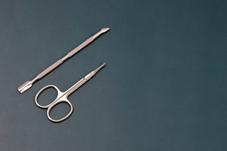 Surgical instruments on a green background, top view, copy spaceの写真素材
