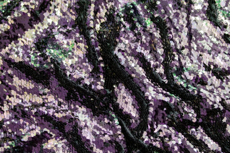 texture, background, pattern. Fabric with sequins in purple and gold. High quality photo