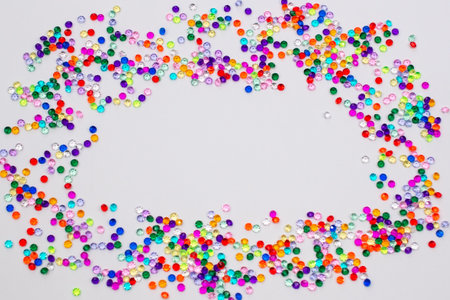 Colorful confetti on white background. Flat lay, top view.の写真素材