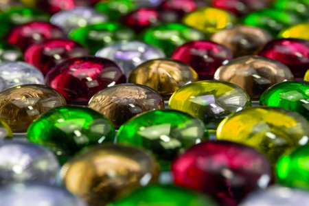 Multicolored glass marbles as a background. Selective focus.の写真素材