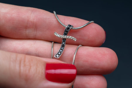 Jewelry ring with a diamond in the hands of a woman