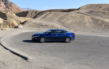 Luxury car in the middle of the desert.