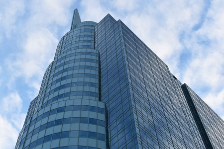 High rise building with blue sky and white clouds, business concept.