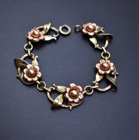 bracelet made of metal in the form of a flower on a dark backgroundの写真素材