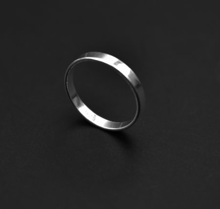 Wedding ring on a black background. Close-up.の写真素材