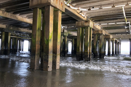 under the pier in a stormy day, closeup of photoの写真素材
