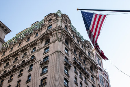 United States of America flag on the facade of a building in Manhattan.の写真素材