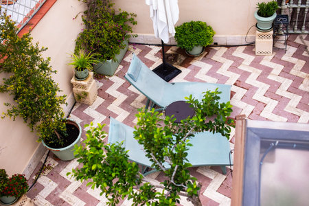 Outdoor cafe terrace with tables and chairs, view from above