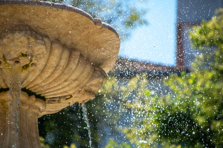 Detail of the fountain in the city park. Shallow depth of fieldの写真素材